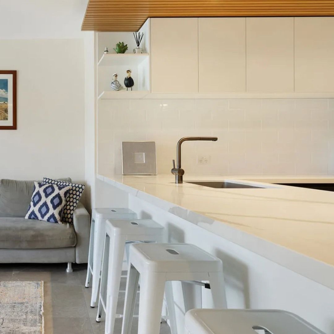 A Kitchen with Stools and A Couch in The Background — Ben Lynch Cabinetmaking in South Lismore, NSW