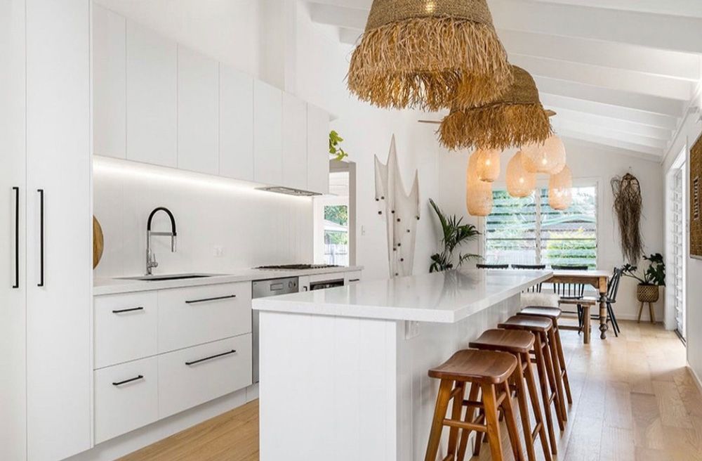 A Kitchen With White Cabinets And A Long Island With Stools — Ben Lynch Cabinetmaking in South Lismore, NSW