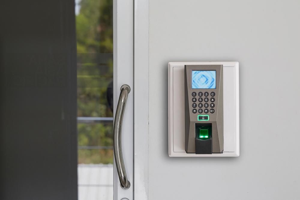 A Fingerprint Scanner Is Mounted on A Wall Next to A Door — Firewerx In Dubbo, NSW