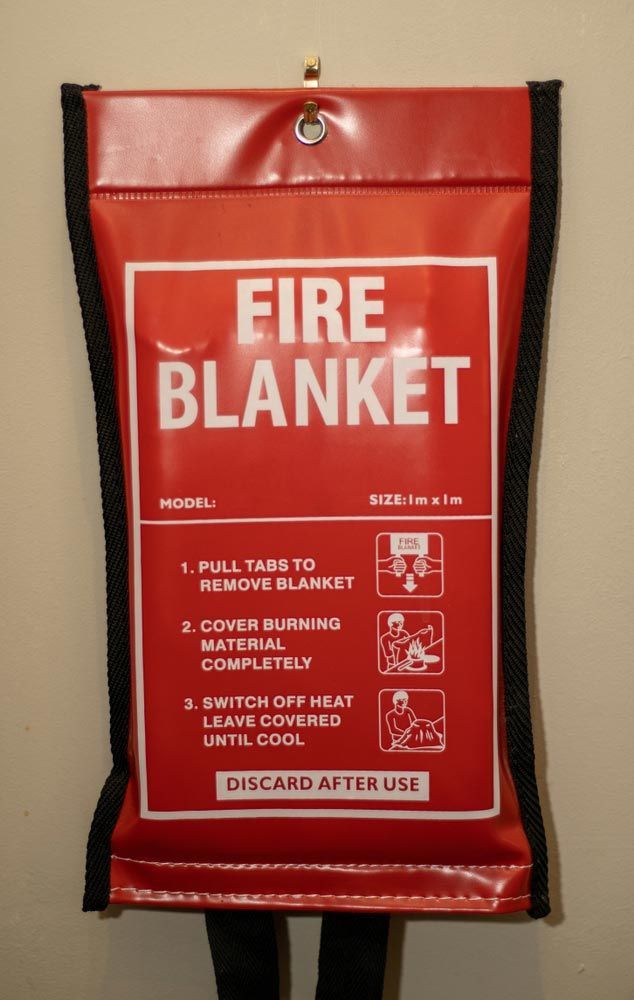 A Red Fire Blanket With Instructions On How To Use It — Firewerx In Dubbo, NSW