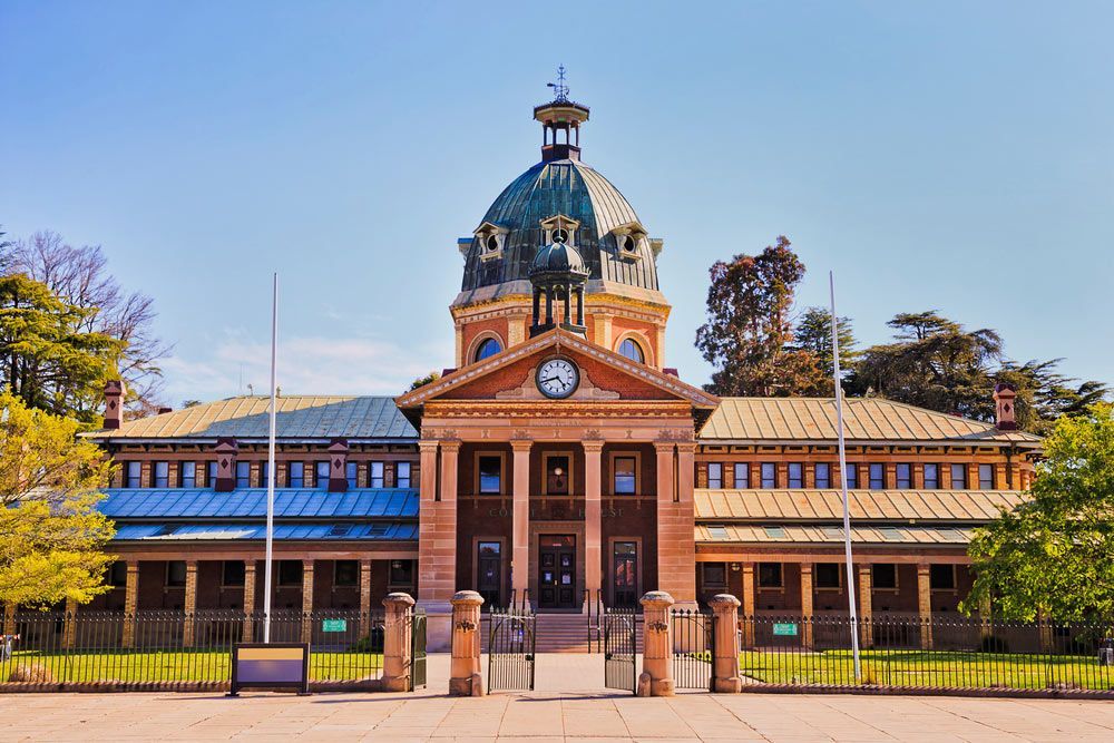 A Large Building With A Dome And A Clock On Top Of It — Firewerx In Bathurst, NSW