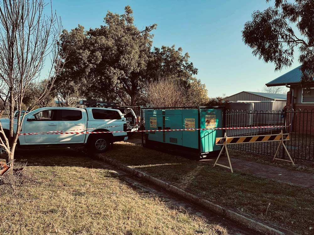 A White Truck Is Parked Next To A Green Trailer — Firewerx In Dubbo, NSW