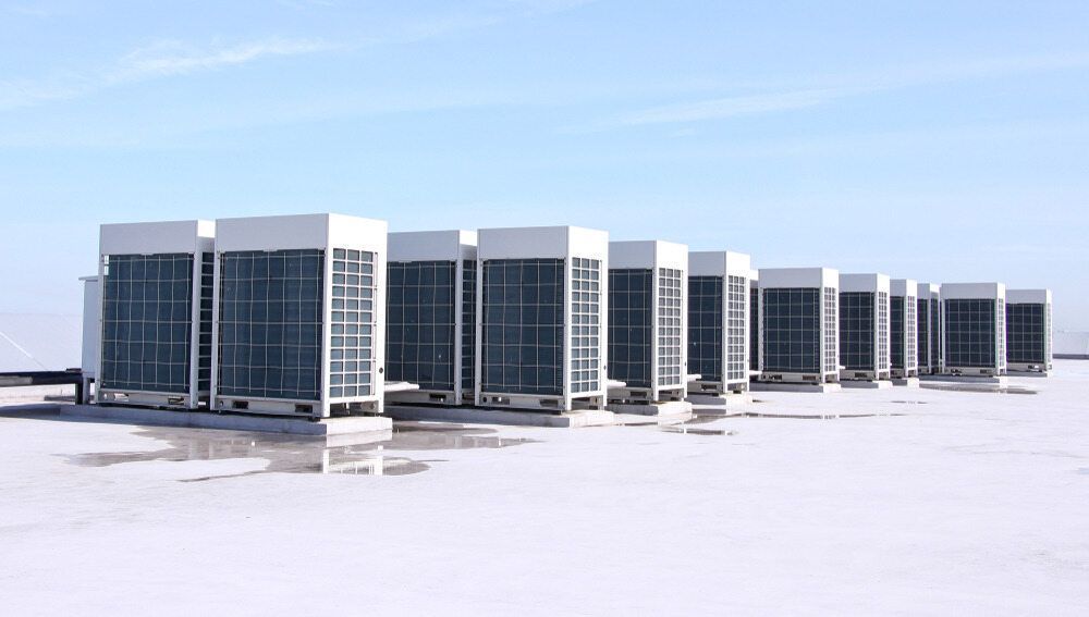 A Row Of Air Conditioners Are Lined Up On The Roof Of A Building — Firewerx In Mudgee, NSW