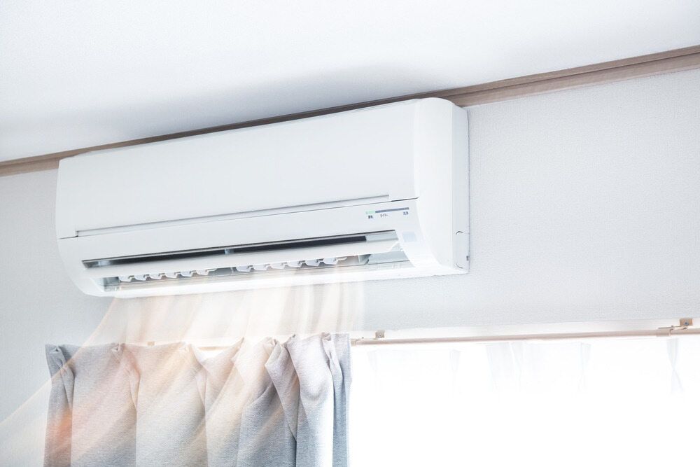 A White Air Conditioner Is Hanging From The Ceiling — Firewerx In Dubbo, NSW