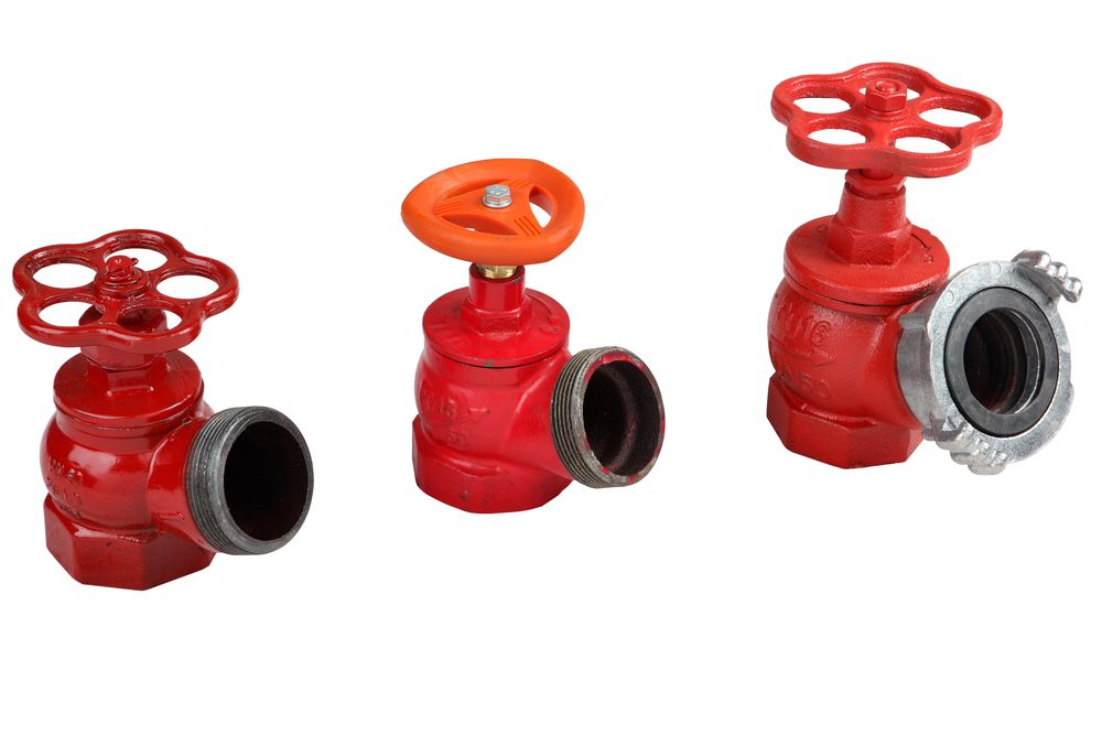 Three Red Fire Hydrant Valves With Orange Handles On A White Background — Firewerx In Dubbo, NSW
