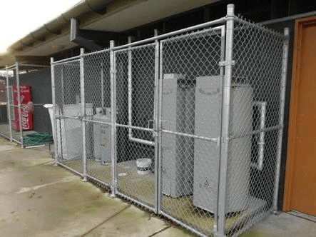 Mesh Metal Fence Surrounding Water Heater— Fencing in Gladstone QLD