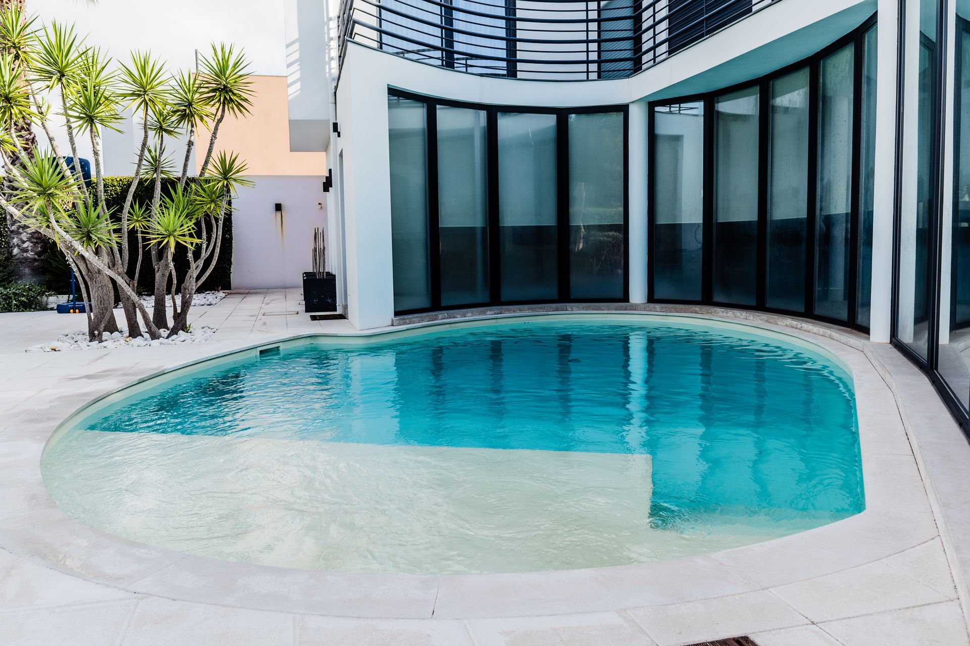 A large swimming pool in the middle of a house
