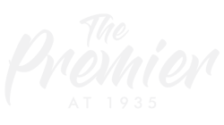 A white logo for the premier at 1935 on a white background.
