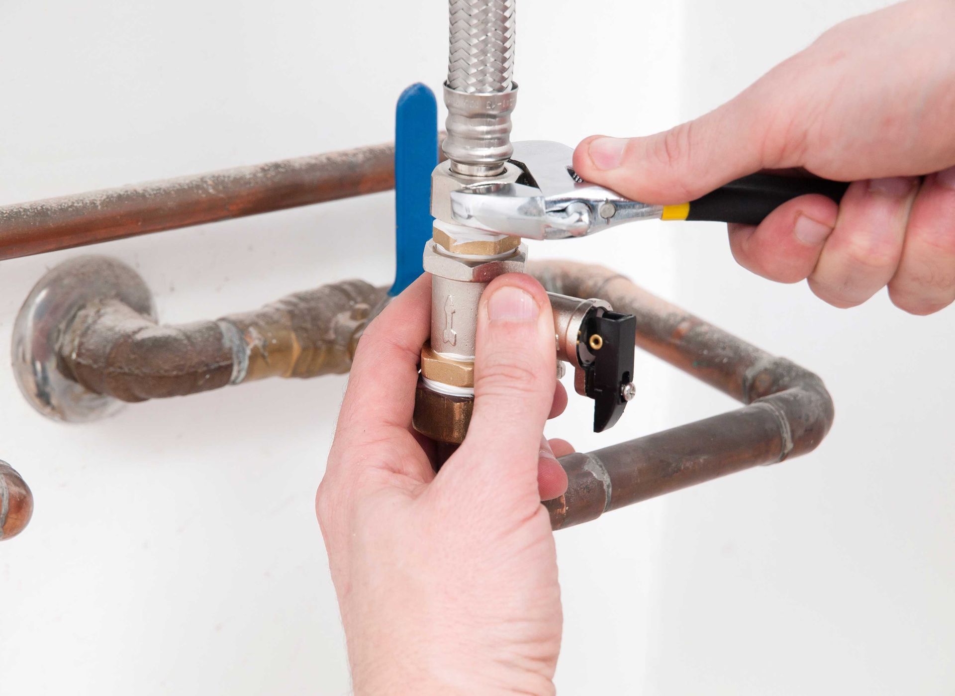 Hands repairing the plumbing pipes. Hands repairing the plumbing pipes.