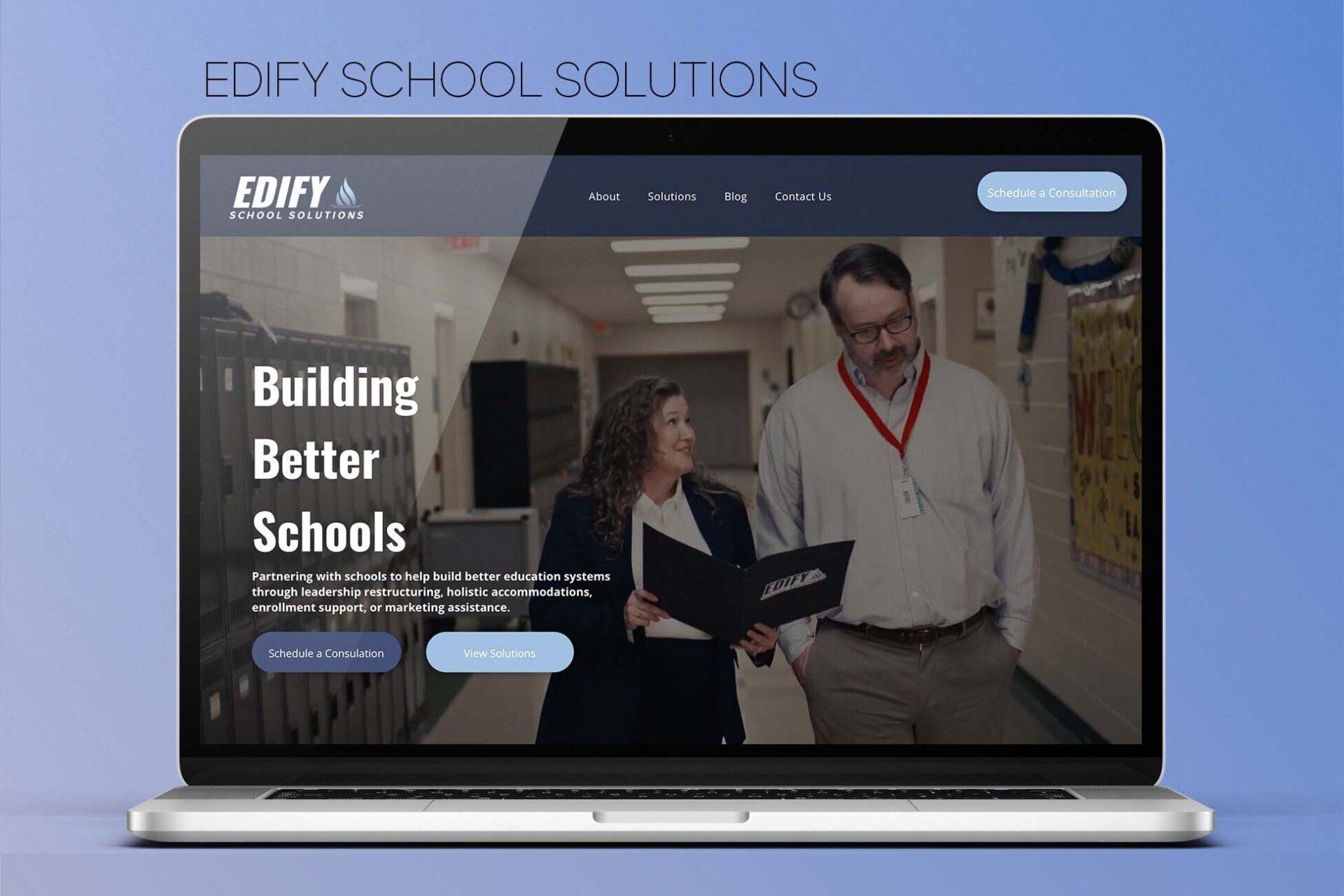 A laptop computer is open to a website for building better schools.