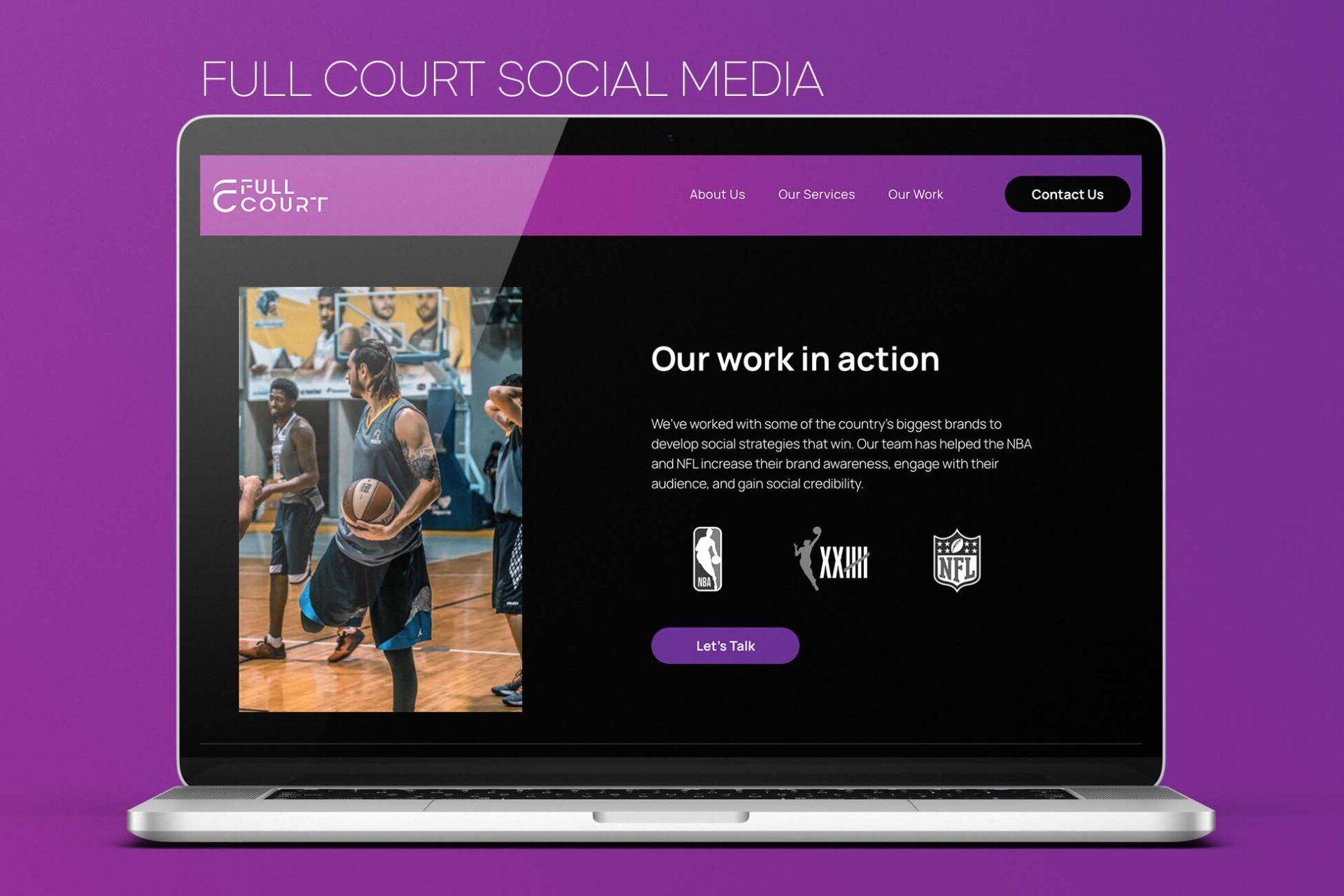 A laptop computer is open to a basketball website.