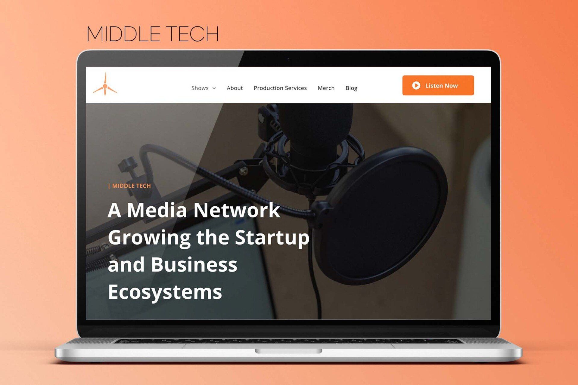 A laptop computer is open to a website about a media network growing the startup and business ecosystems.