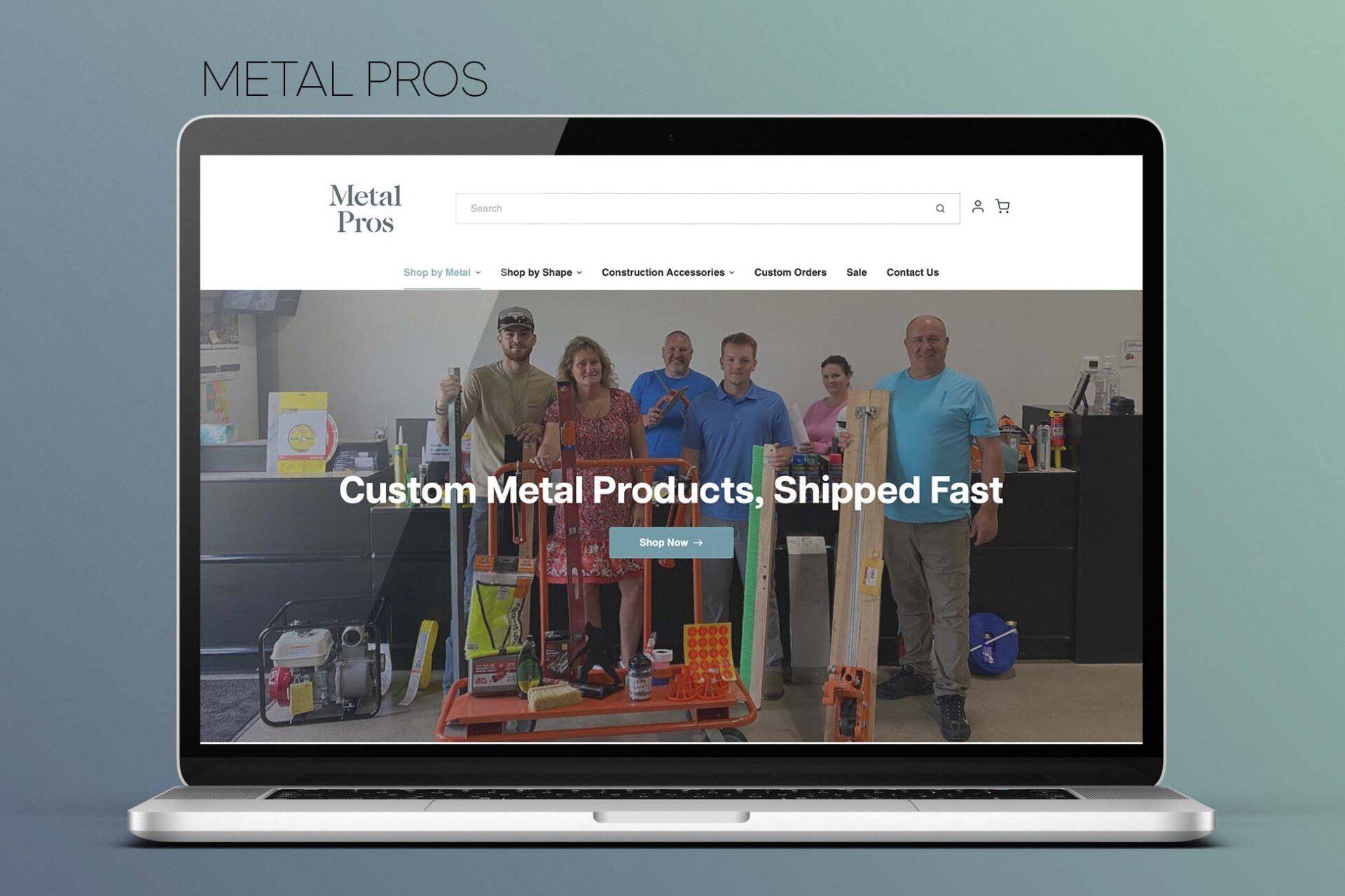 A laptop computer is displaying a website for a company called metal pros.