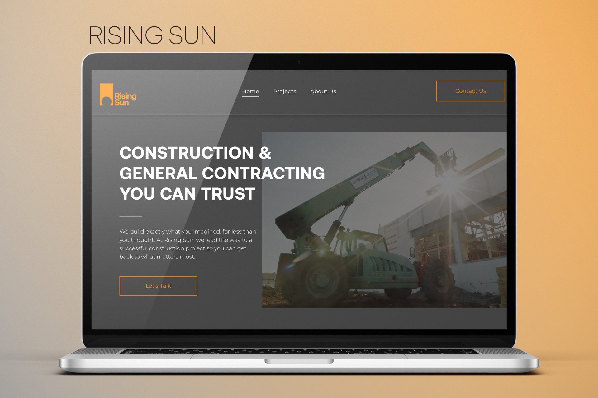 A laptop computer is open to a construction and general contracting website.