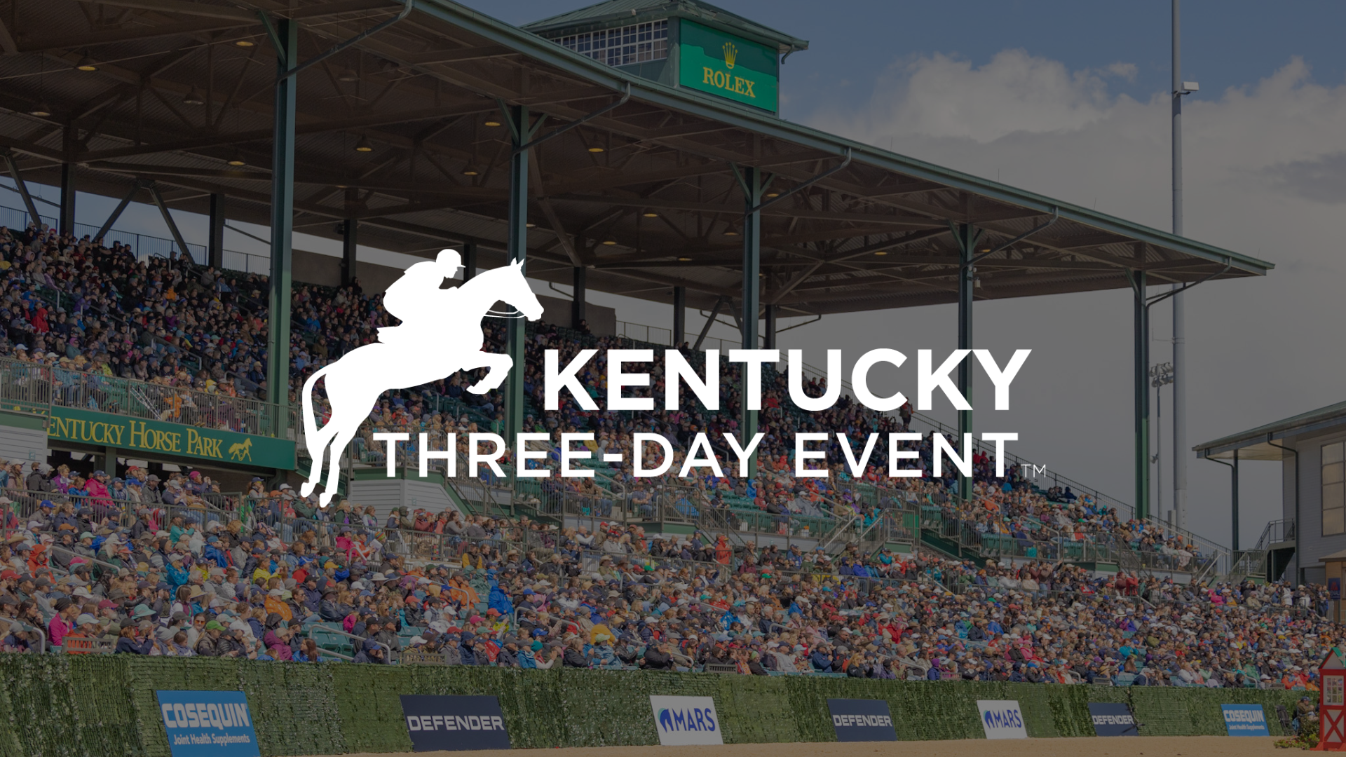 A kentucky three-day event logo with a horse and rider on a horse.