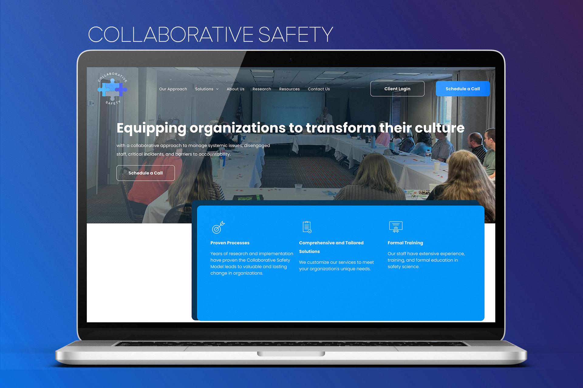 A laptop computer is open to a website about collaborative safety.