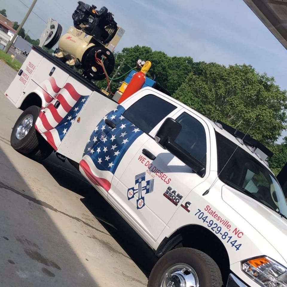 White Dodge Ram truck with American flag graphics and welding equipment, Statesville, NC.