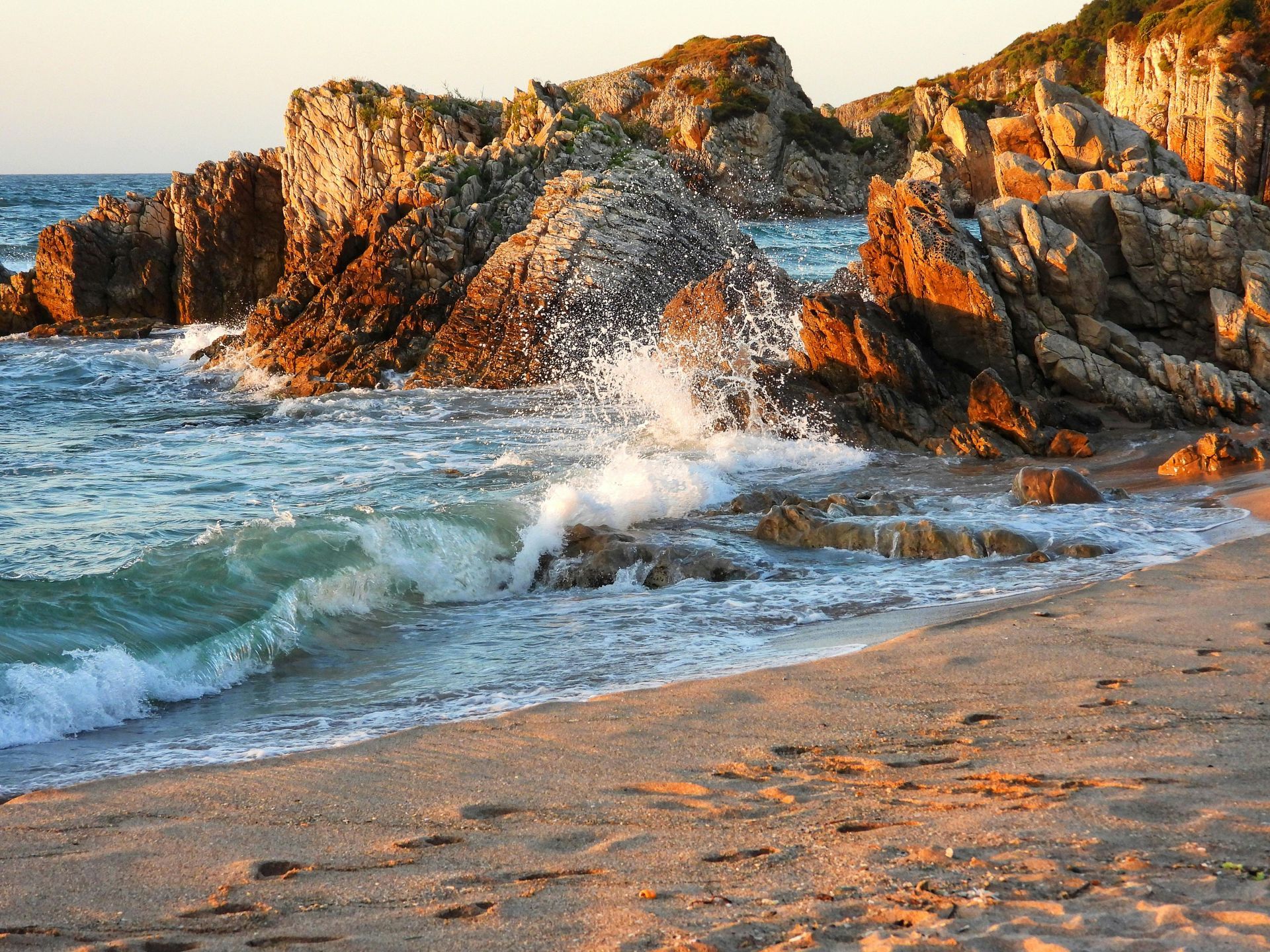 sea crashing against rocks as tide comes in