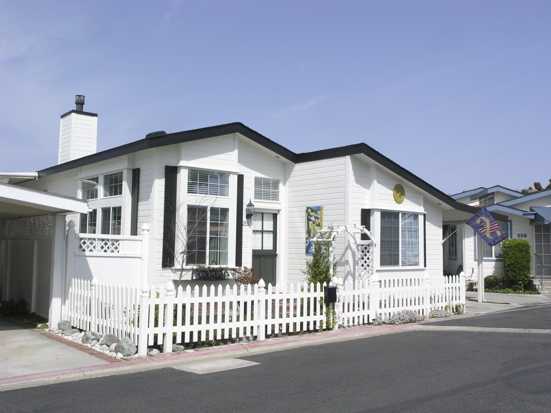 View of Bayside Village home with picket fence