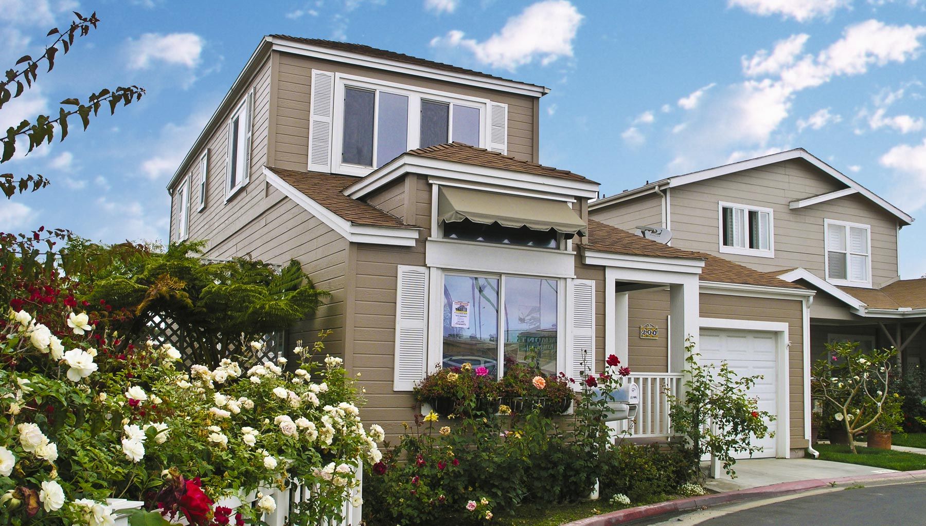 Two Story Modular Homes with Floral Landscaping in Bayside Village Mobile Home Park.