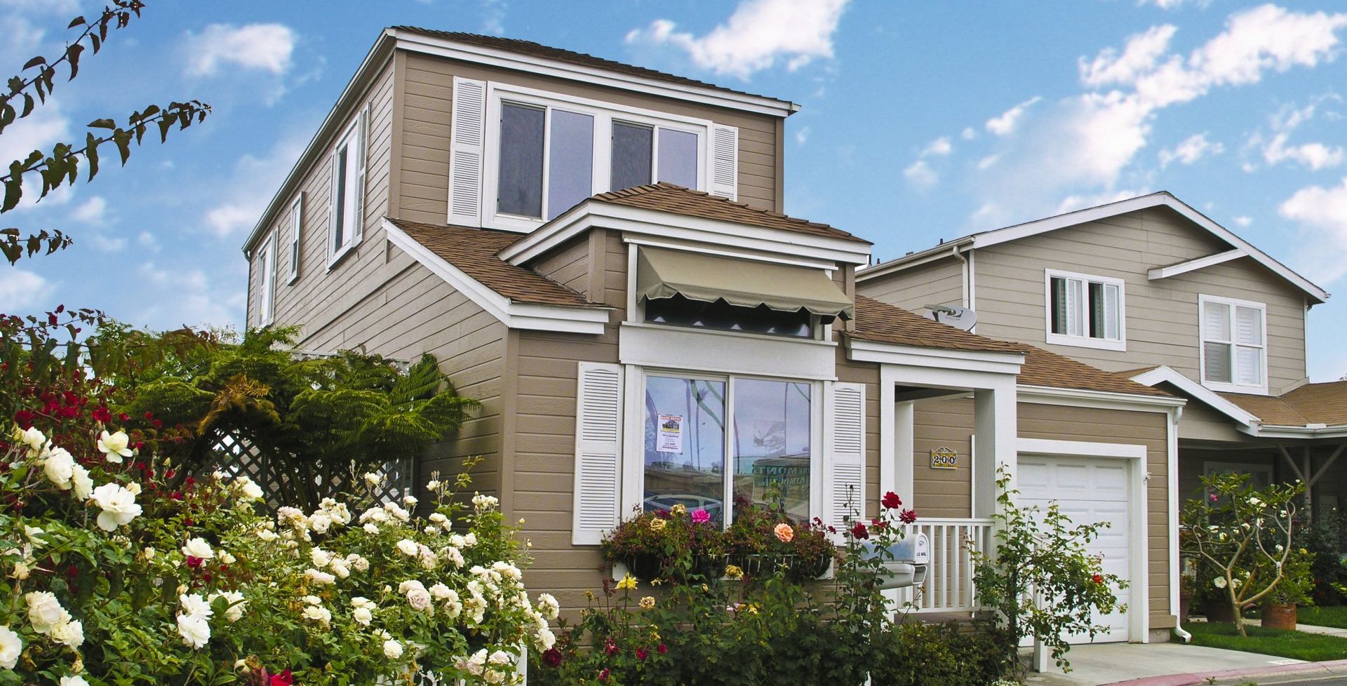 Two Story Home in Baside Village Community with Floral Garden