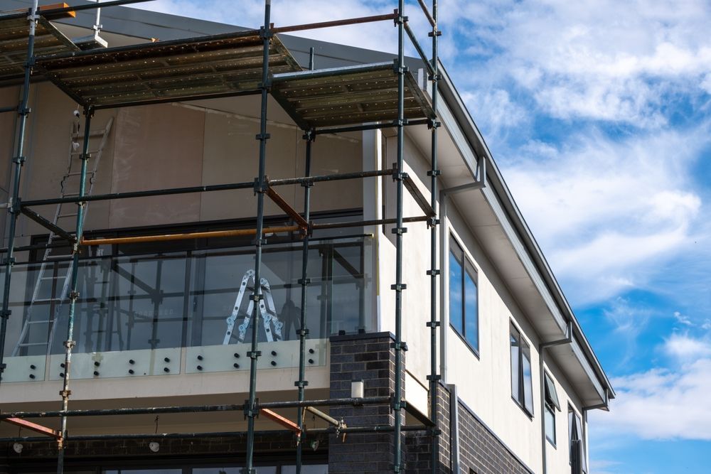 A house is being built with scaffolding around it.