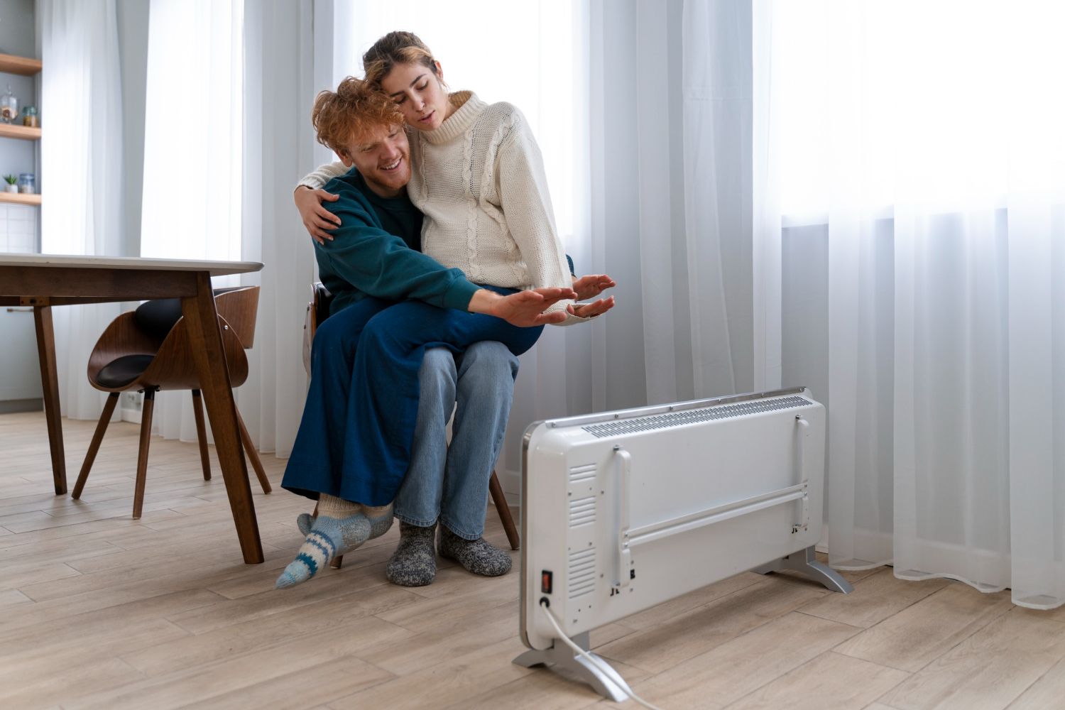 couple enjoying house heater