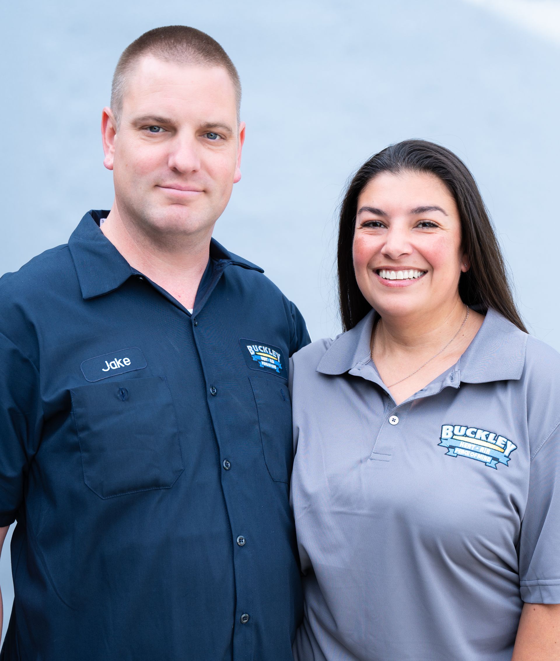 A man and a woman are posing for a picture together.