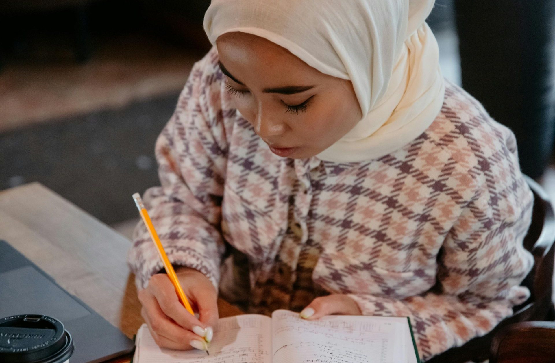 Woman writing in journal