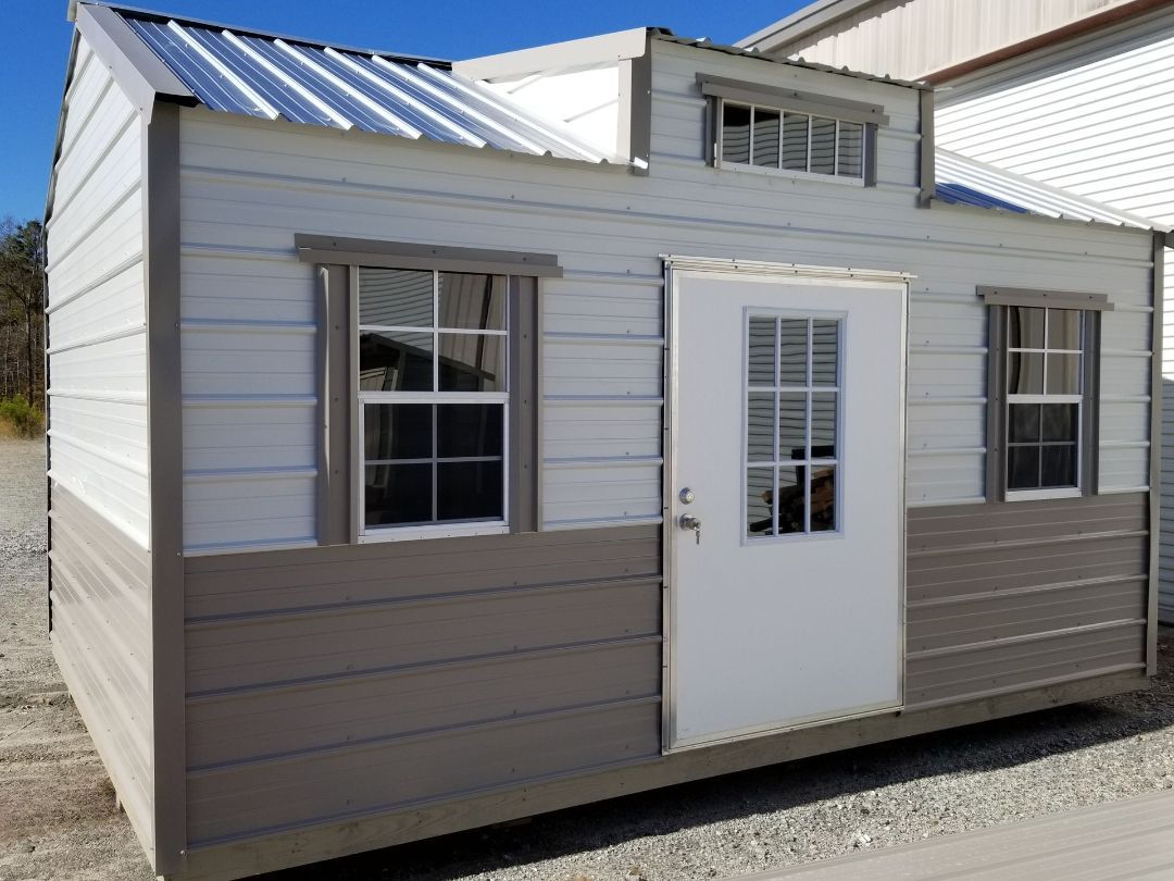 A small house with a white door and windows