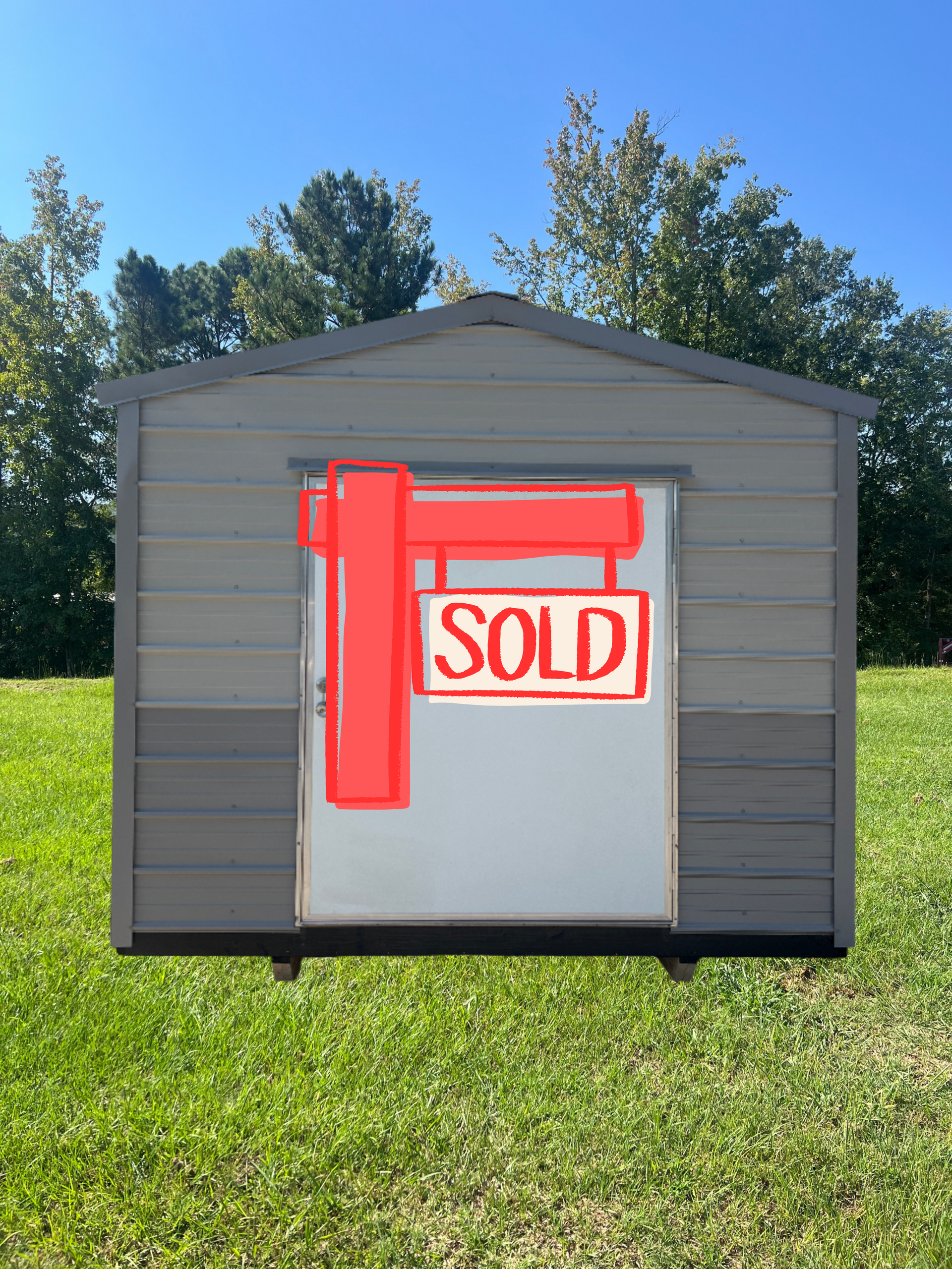 Gray metal shed with a black trim and door; 