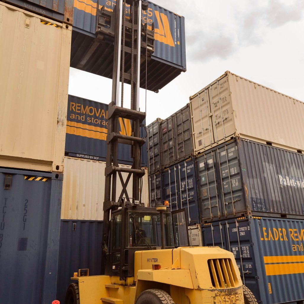 A Forklift Is Lifting a Container that Says Removal and Storage — Leader Removals & Storage in Canberra, ACT
