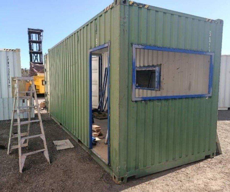 A Green Shipping Container with A Ladder in Front of It — Leader Removals & Storage in Mitchell, ACT