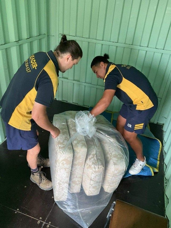 Two People Are Carrying a Large Bag of Food — Leader Removals & Storage in Mitchell, ACT