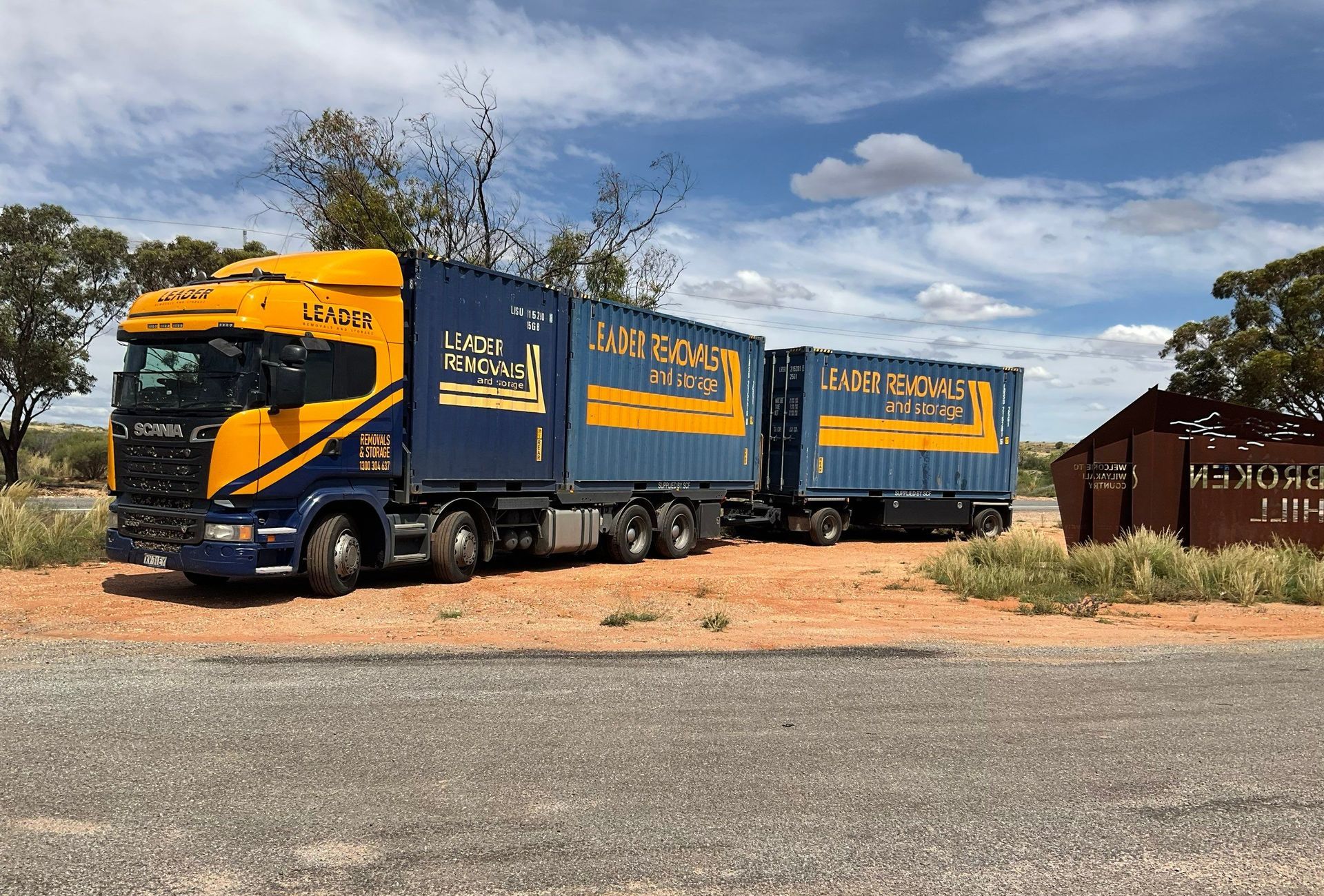 A Large Blue and Yellow Removalist Truck — Leader Removals & Storage in Canberra, ACT