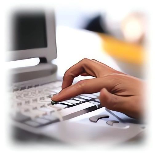A Close up Of a Person Typing on A Laptop — Leader Removals & Storage in Mitchell, ACT
