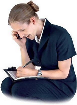 A Woman Is Writing on A Clipboard While Talking on A Cell Phone — Leader Removals & Storage in Mitchell, ACT
