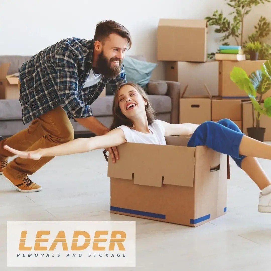 Man Pushing Woman in A Box — Leader Removals & Storage in Mitchell, ACT
