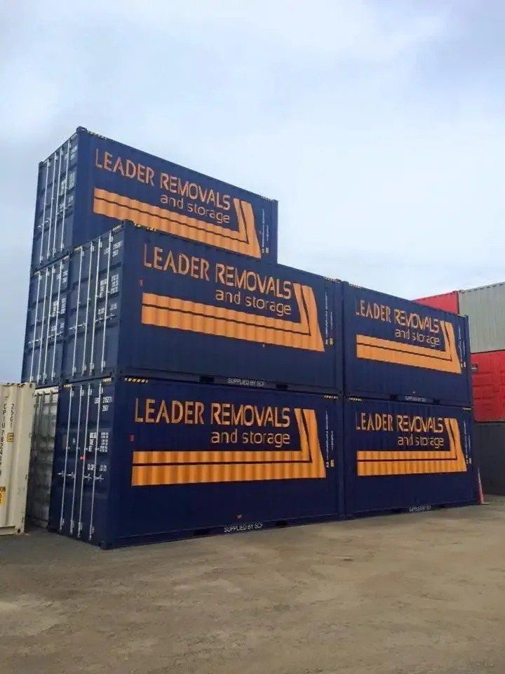 A Stack of Blue Containers with The Words Leader Removals and Storage on Them — Leader Removals & Storage in Mitchell, ACT