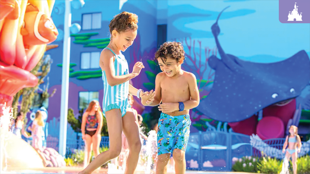 Two children playing in a water area at the 