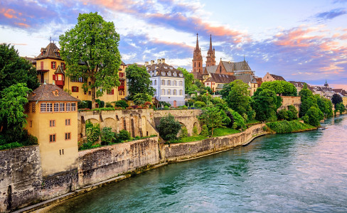 stone wall against water way with masonry buildings