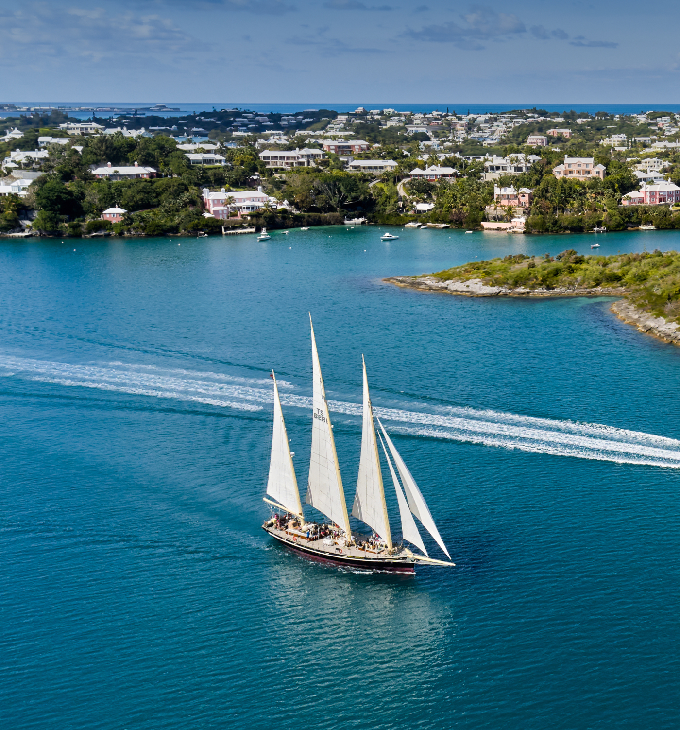 An aerial view of a sailboat in the ocean