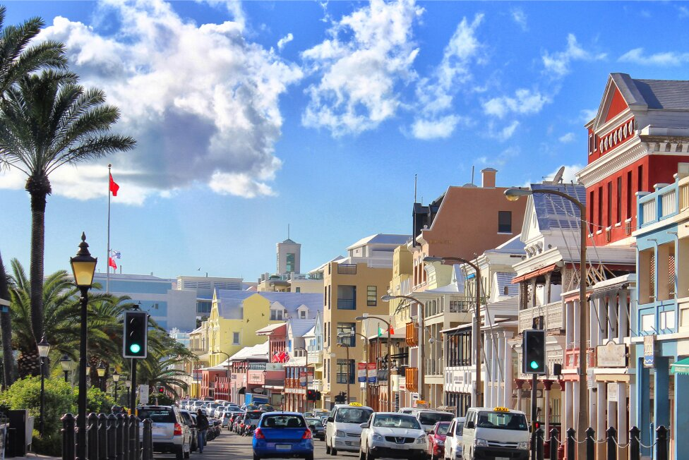 quaint city buildings palm trees blue skies