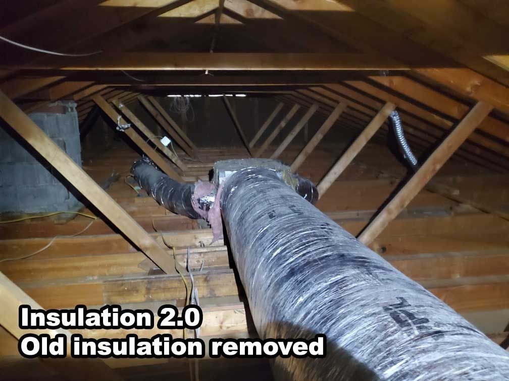 A picture of an attic with old insulation removed