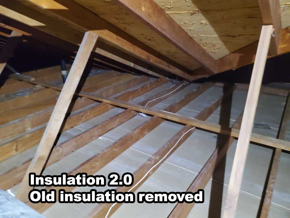 A picture of an attic with old insulation removed