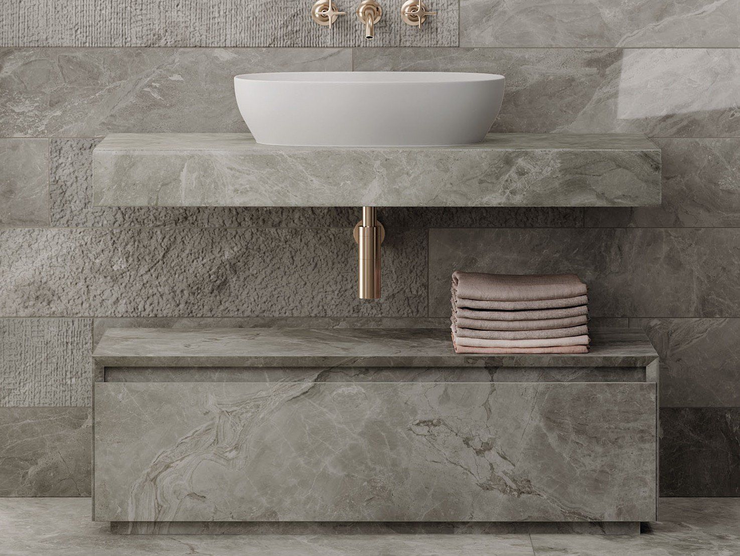 Un bagno con un lavandino e una pila di asciugamani sotto.