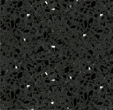 Primo piano di un piano di lavoro in granito nero con brillantini bianchi.