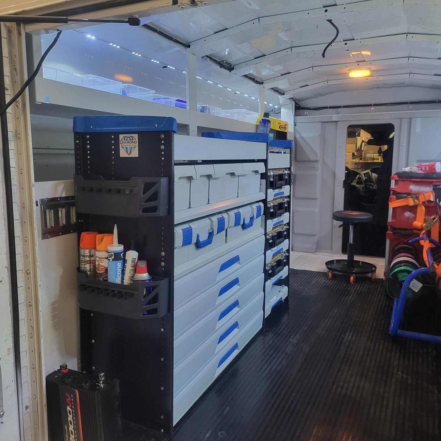 The inside of a van with a shelf that says ' a ' on it