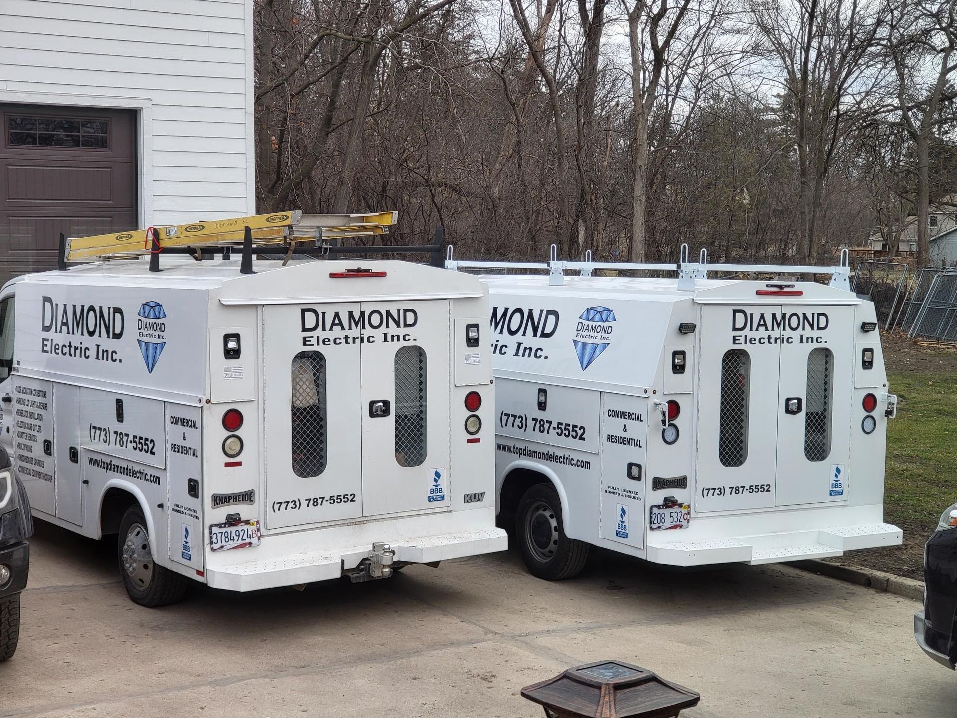 Two diamond trucks are parked next to each other
