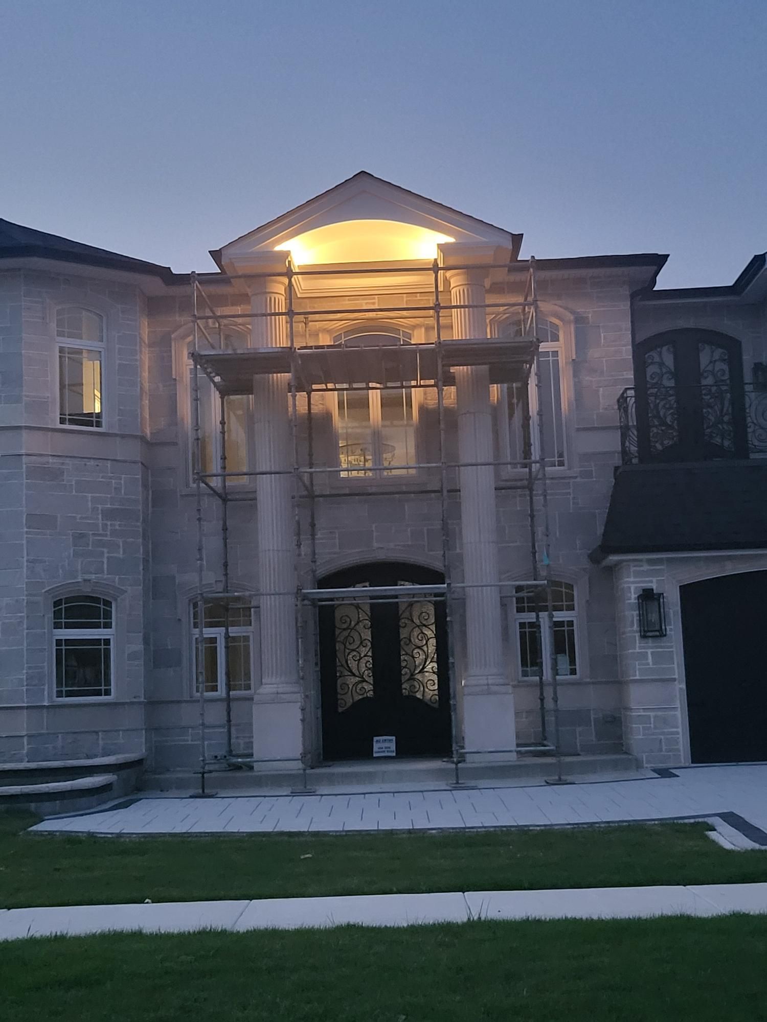 A large house with scaffolding in front of it